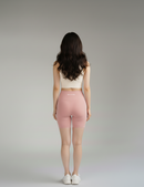 Back view of BELVYNN Women’s Performance Pink Shorts, showcasing the no-ride-up fit and high-compression athletic silhouette.