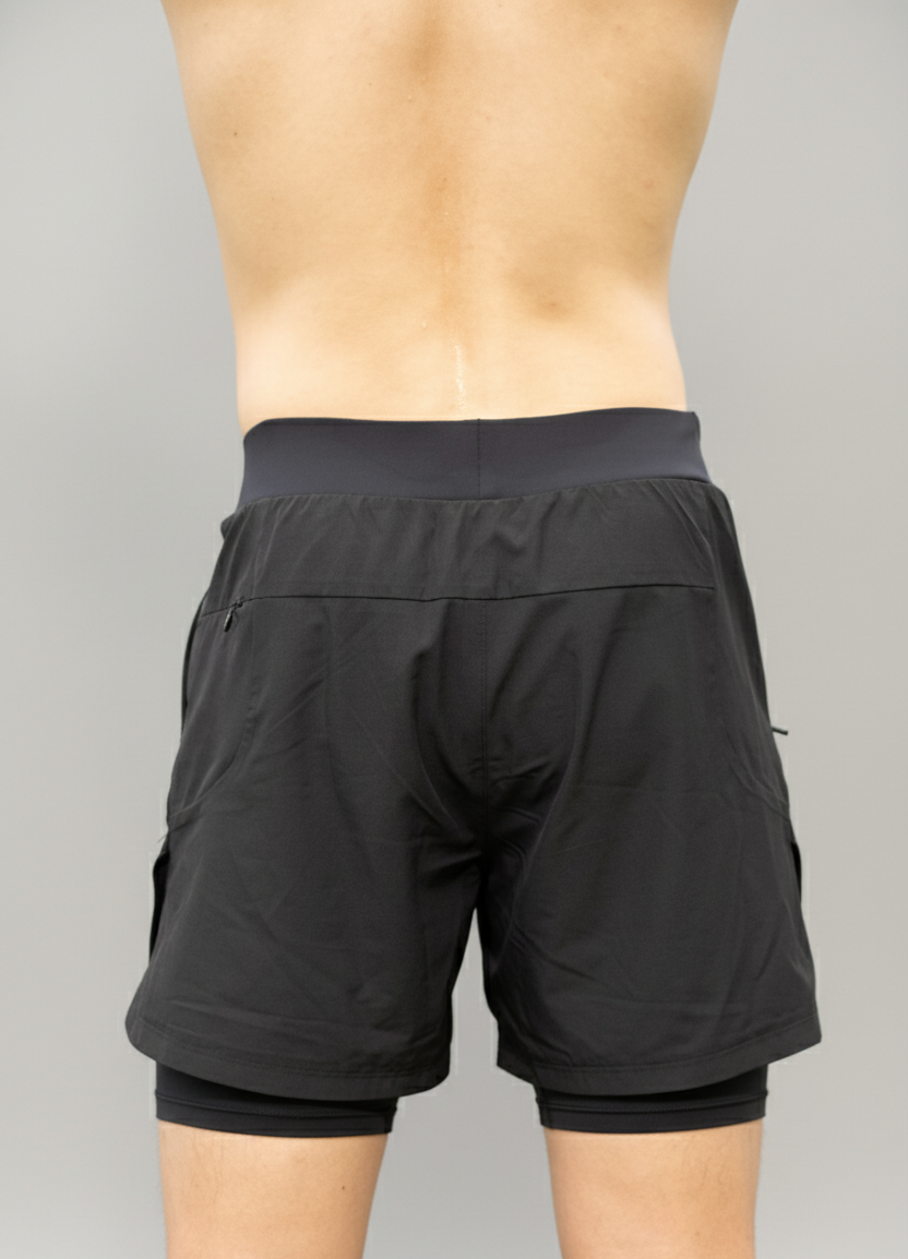 Back view of a male model wearing BELVYNN Men’s premium 2-layer Essential Gym Shorts in Black with a 5-inch pro-inseam, optimized for the Asian athlete’s mobility and fit.