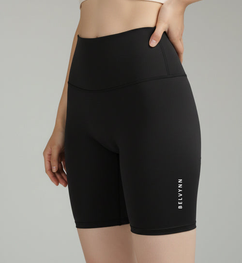 Close up view of BELVYNN Women’s Performance Shorts in black, showcasing the no-ride-up fit and high-compression athletic silhouette.