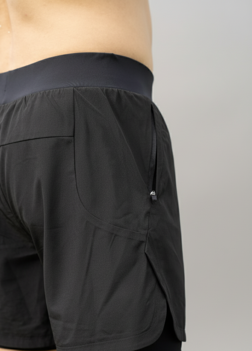Close up view of a male model wearing BELVYNN Men’s premium 2-layer Essential Gym Shorts in Black with a 5-inch pro-inseam, optimized for the Asian athlete’s mobility and fit.