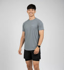 Front view of a male athlete wearing the BELVYNN Men’s Performance T-shirt in gray, highlighting the V-taper silhouette and climate-tech moisture management.