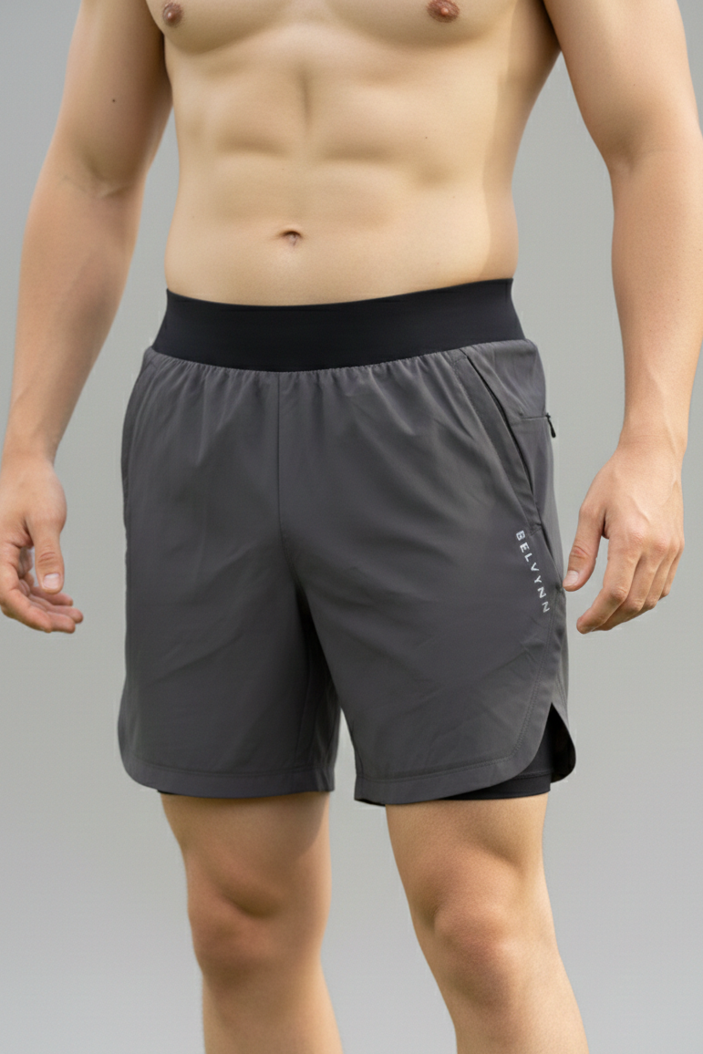 Front view of a male model wearing BELVYNN Men’s premium 2-layer Essential Gym Shorts in Gray with a 5-inch pro-inseam, optimized for the Asian athlete’s mobility and fit.