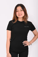 Front view of a person wearing a BELVYNN premium black t-shirt and black shorts on a white background