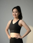 Front view of the BELVYNN High-Impact Signature Bra in Black, engineered with anti-gravity support and moisture-wicking technology. 