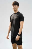 Male athlete wearing the BELVYNN Men’s Performance T-shirt in black, highlighting the V-taper silhouette and climate-tech moisture management.