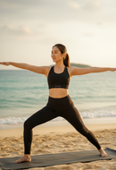 On beach yoga pose view of BELVYNN Women’s Long-Inseam Leggings in charcoal, featuring high-rise support and premium 40% Spandex stability.