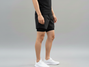 Side view of a male model wearing BELVYNN Men’s premium 2-layer Essential Gym Shorts in Black with a 5-inch pro-inseam, optimized for the Asian athlete’s mobility and fit.